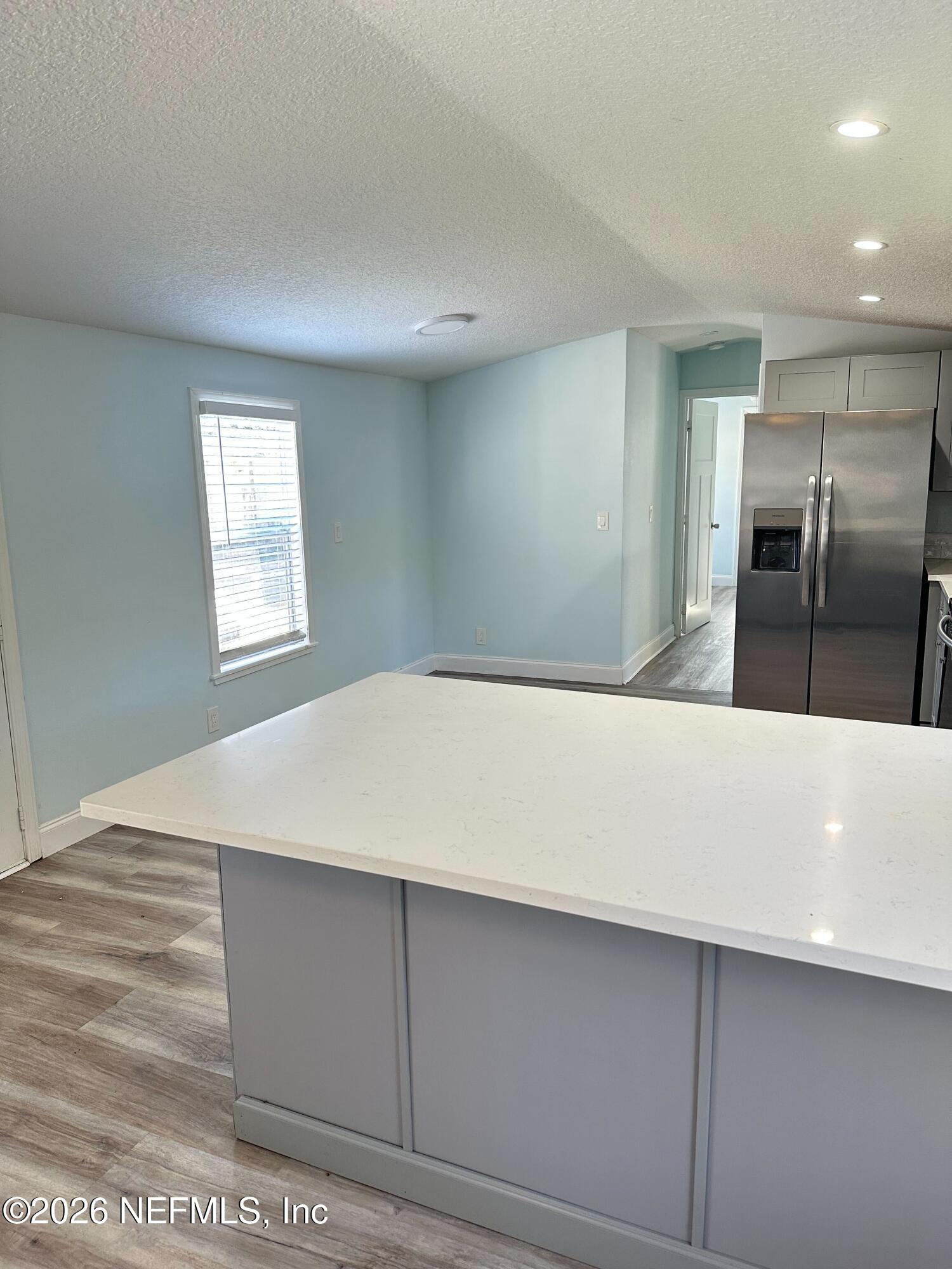 1635 Natalie Road St. Augustine, FL 32084 - Photo 6 of 16 a view of kitchen cabinets and wooden floor