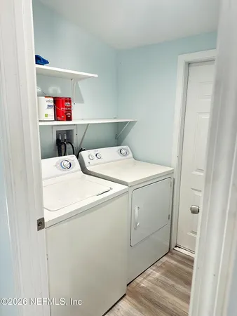 a utility room with dryer and washer