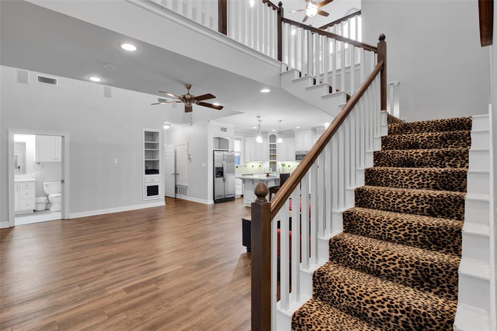 3815 Holly Ridge Drive, Unit GUEST Longview, TX 75605 - Photo 11 of 33 Staircase featuring wood handrails and white balusters