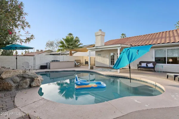 a view of a patio in backyard