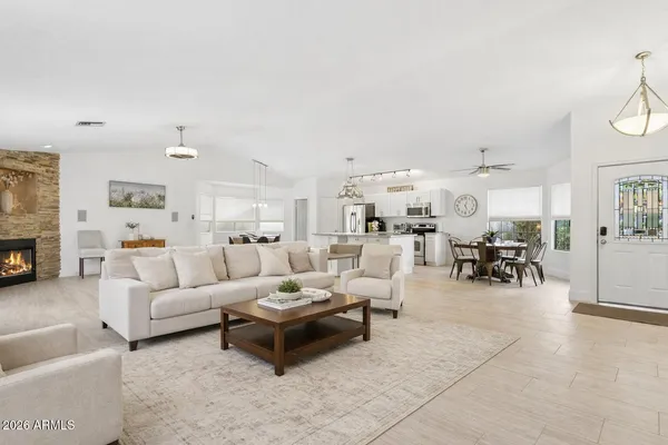 a view of a dining room with furniture and window