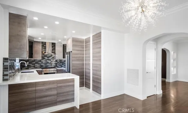a view of a hallway with a kitchen