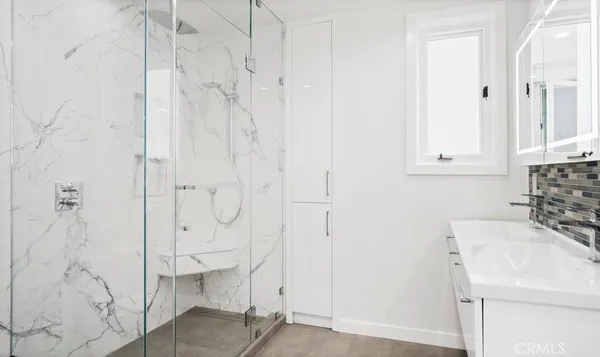 a bathroom with a sink and a shower