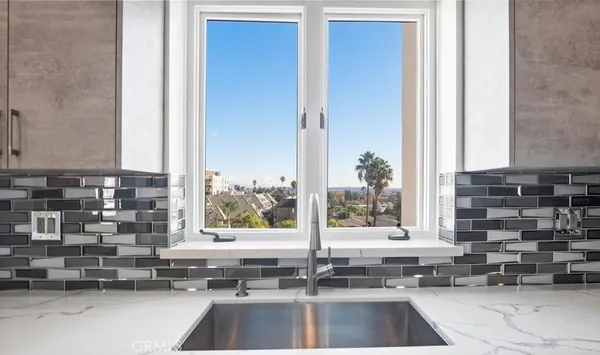 a kitchen with a sink and a window