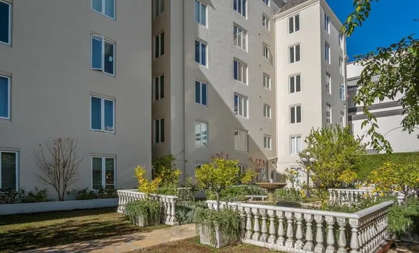 a view of a brick building with many windows
