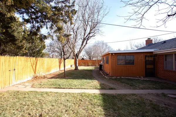 a view of a backyard of the house