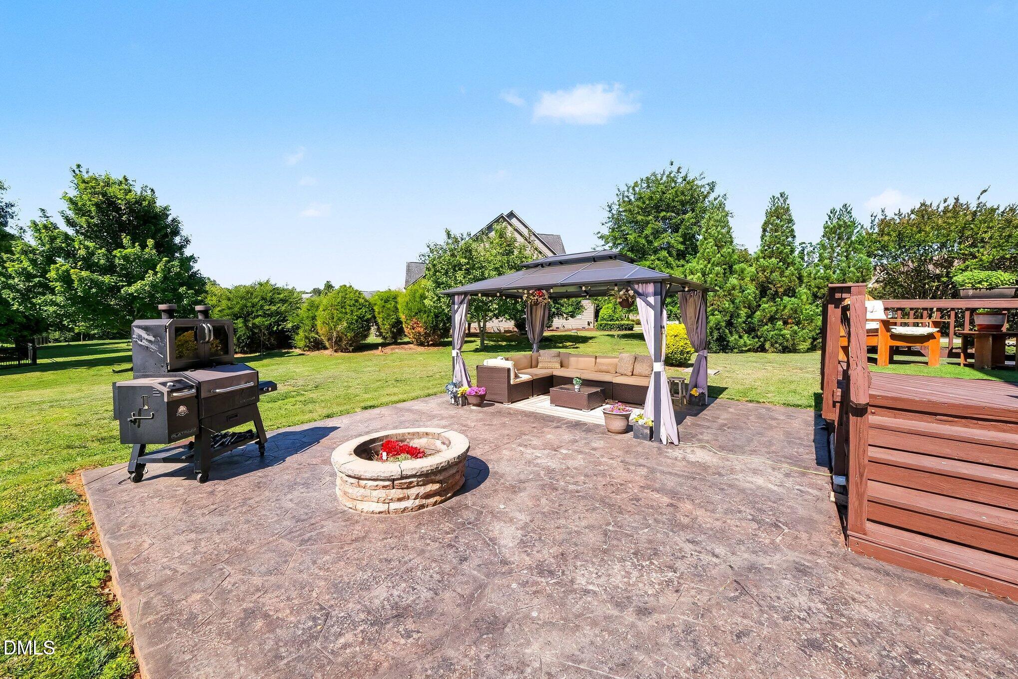 4000 Banks Stone Drive Raleigh, NC 27603 - Photo 41 of 60 a view of a backyard with sitting area