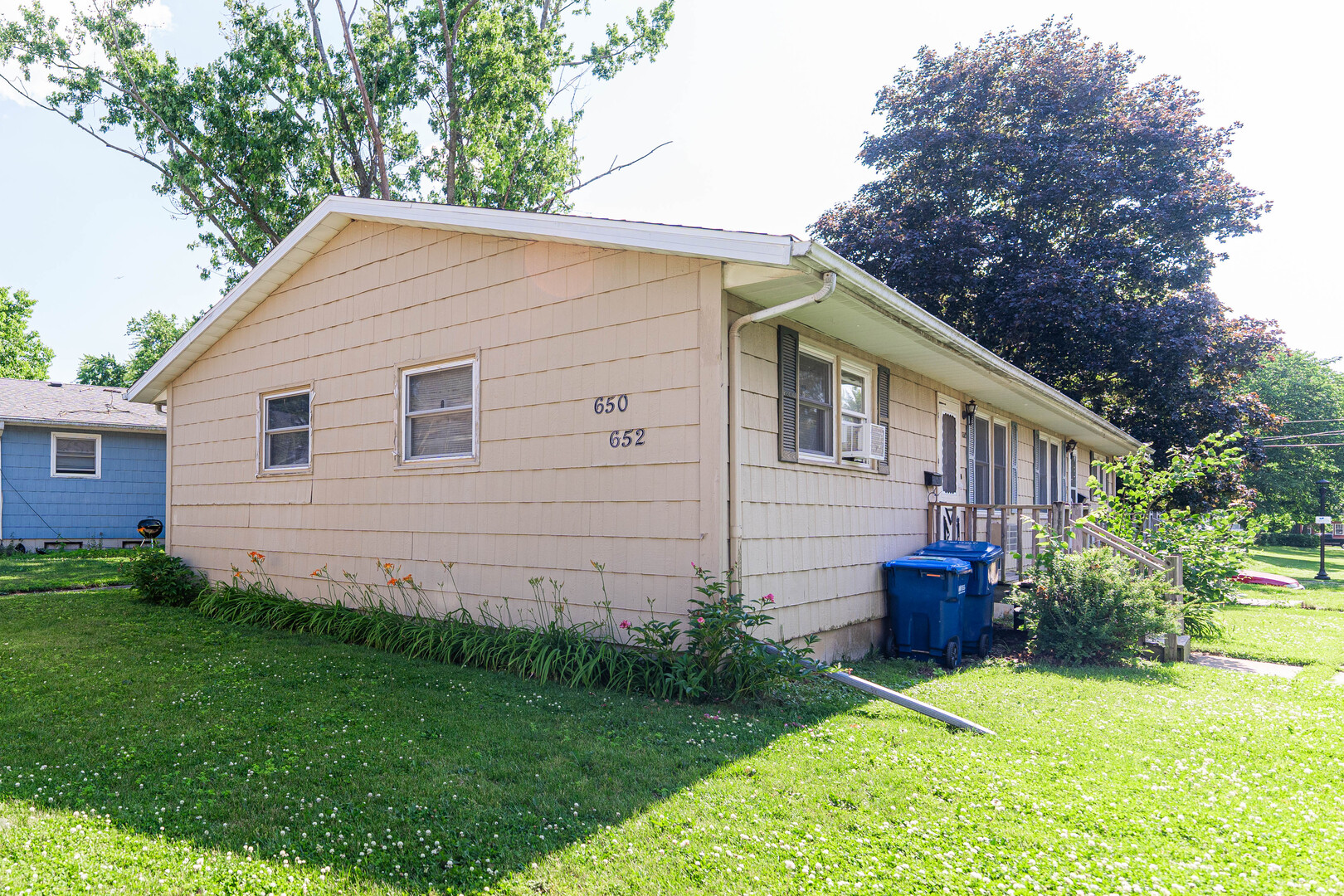 650 North 11th Street DeKalb, IL 60115 - Photo 7 of 9 a view of a backyard with plants and large tree