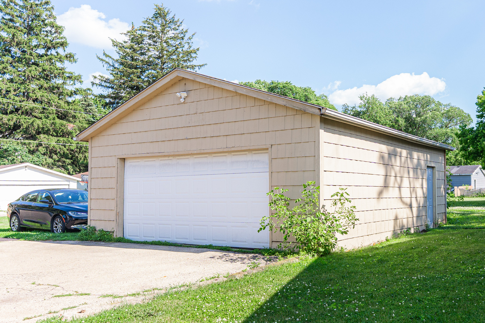 650 North 11th Street DeKalb, IL 60115 - Photo 8 of 9 a front view of house with yard and green space