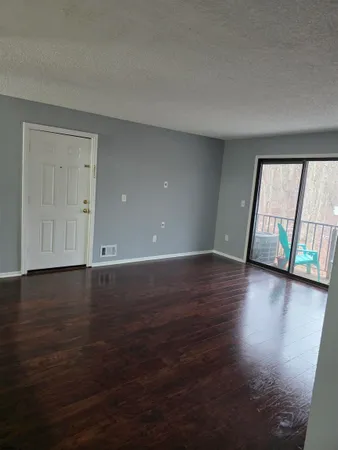a view of a livingroom with wooden floor
