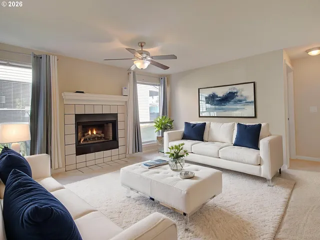 a living room with furniture and a fireplace