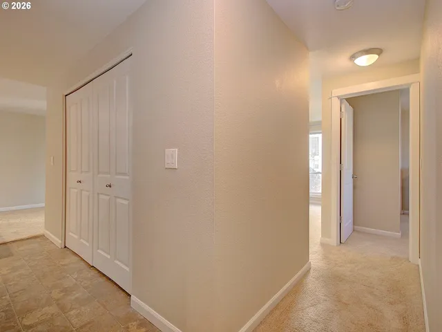 a view of a hallway with closet area