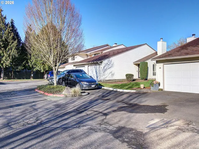 a view of a yard with car parked