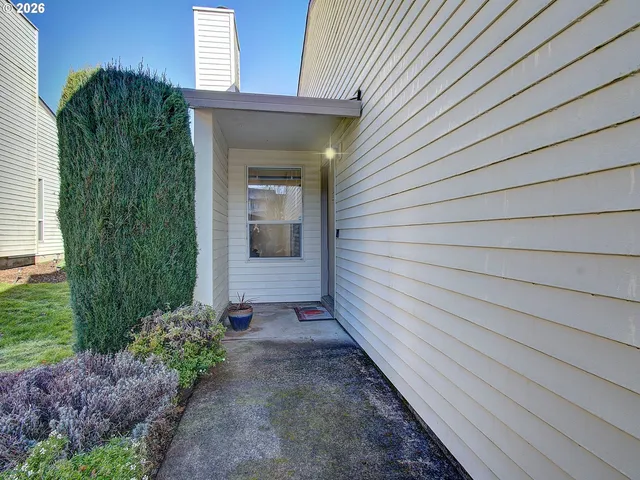 a view of a pathway besides a house