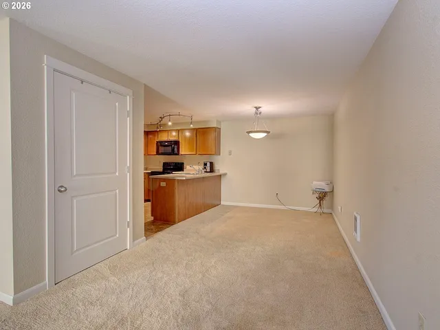 a view of a kitchen with a sink cabinets and a window