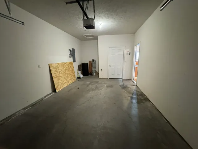 a view of a livingroom with a kitchen