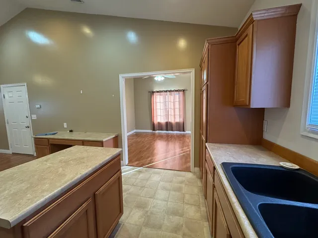 a kitchen with a sink and a refrigerator