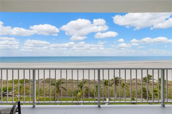a view of a chairs and table in patio