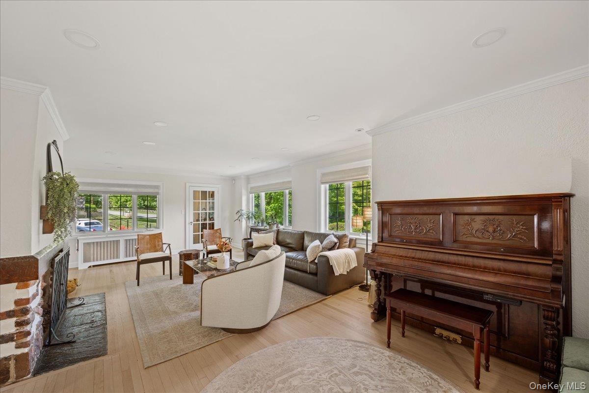 311 Lyncroft Road New Rochelle, NY 10804 - Photo 7 of 39 a living room with furniture and a piano