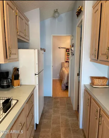 a kitchen with a stove a sink and a microwave