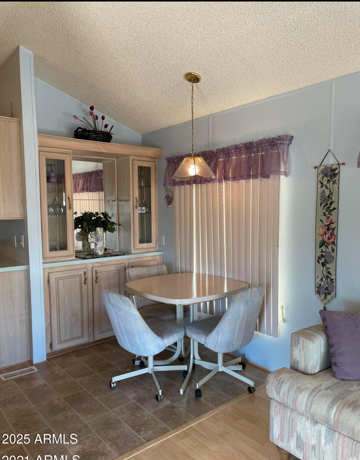 1196 West Klamath Circle, Unit 196 Apache Junction, AZ 85119 - Photo 6 of 8 a dining room with furniture and window