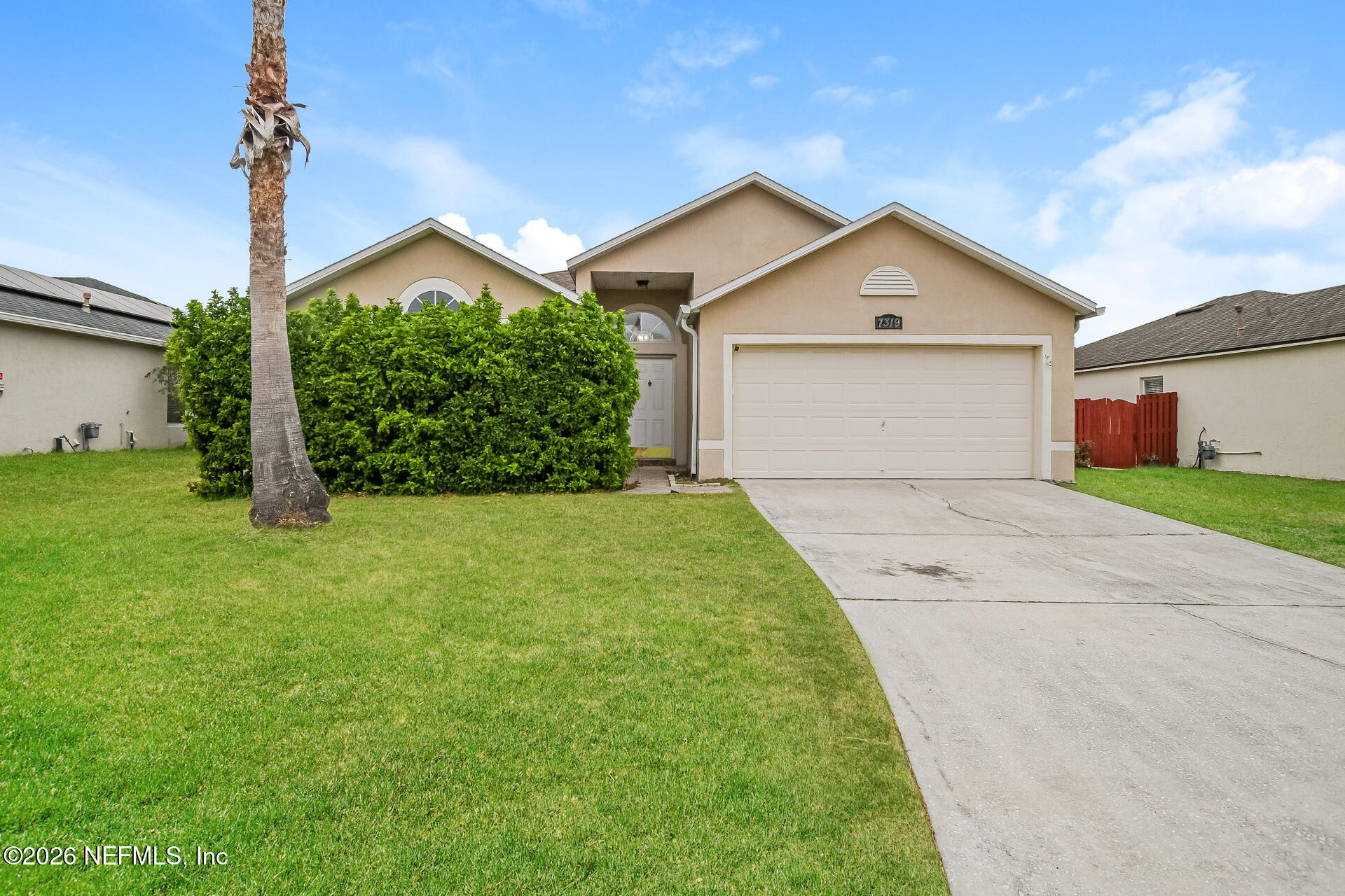 7319 Wood Duck Road Jacksonville, FL 32244 - Photo 1 of 21 a front view of a house with garden
