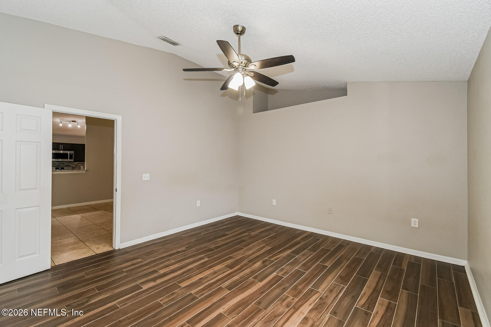 7319 Wood Duck Road Jacksonville, FL 32244 - Photo 12 of 21 a view of empty room with wooden floor
