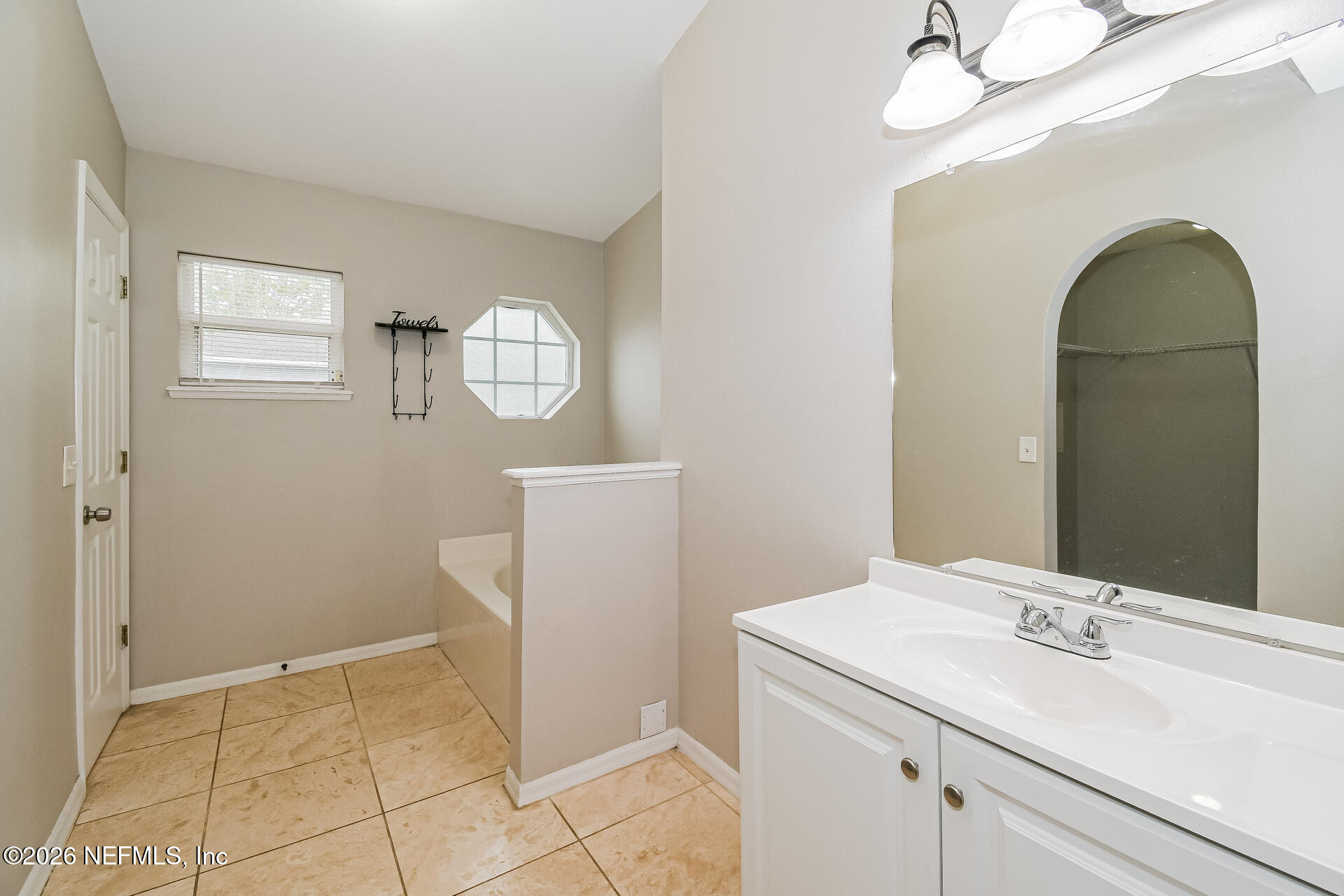 7319 Wood Duck Road Jacksonville, FL 32244 - Photo 15 of 21 a bathroom with a sink a toilet and a mirror