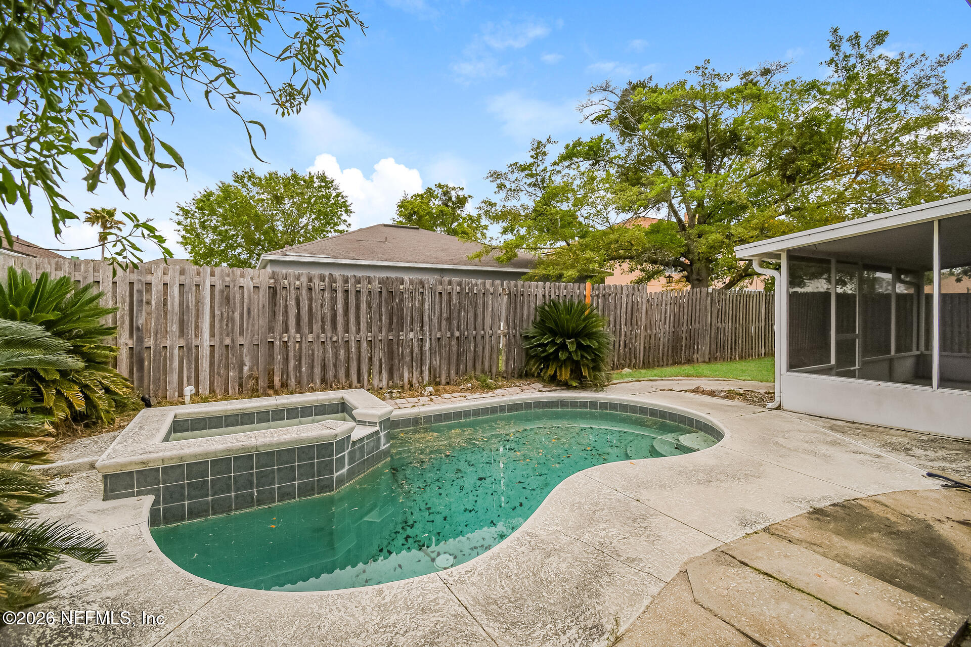 7319 Wood Duck Road Jacksonville, FL 32244 - Photo 19 of 21 a backyard of a house with yard and outdoor seating