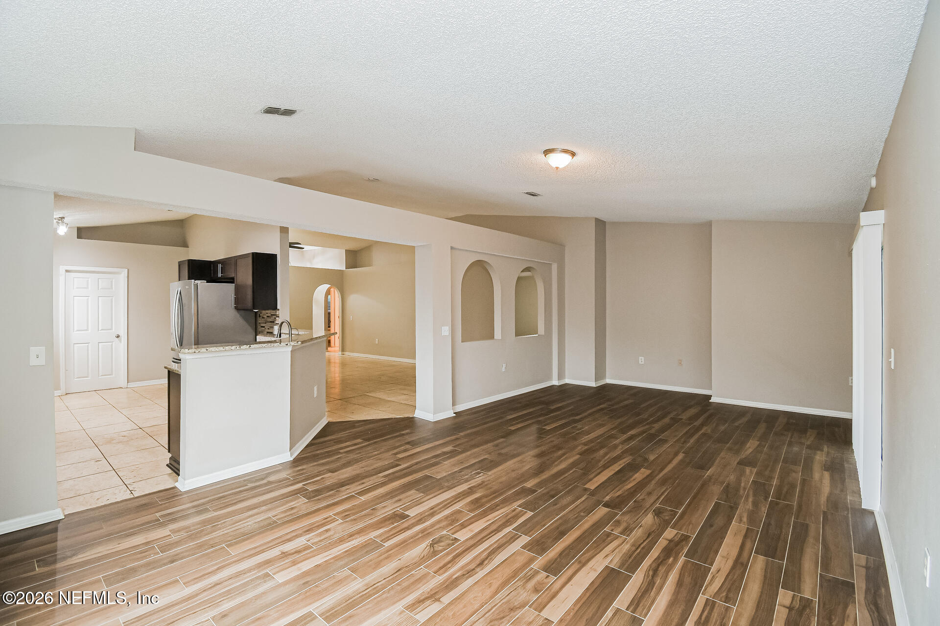 7319 Wood Duck Road Jacksonville, FL 32244 - Photo 4 of 21 a view of a kitchen with wooden floor and a kitchen