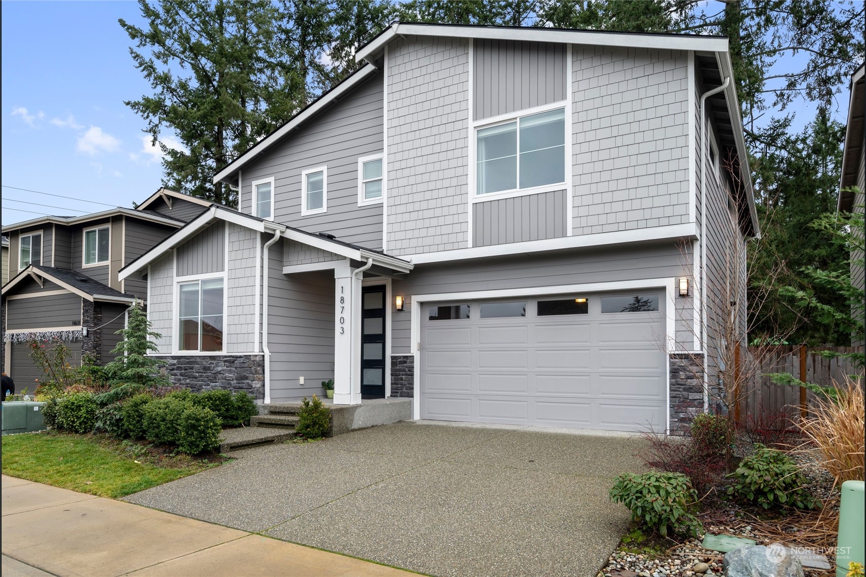 18703 Meridian Place West Bothell, WA 98012 - Photo 1 of 1 a front view of a house with a yard and garage