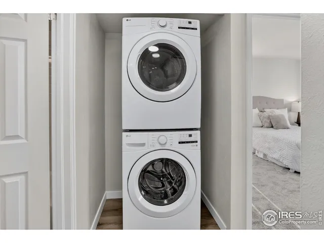 a view of a bedroom with washer and dryer