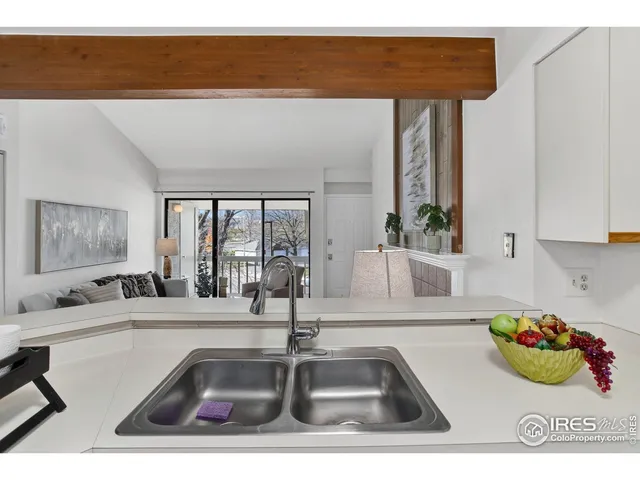 a kitchen with a sink and a window