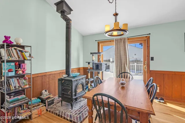 a view of a dining room with furniture wooden floor and a window