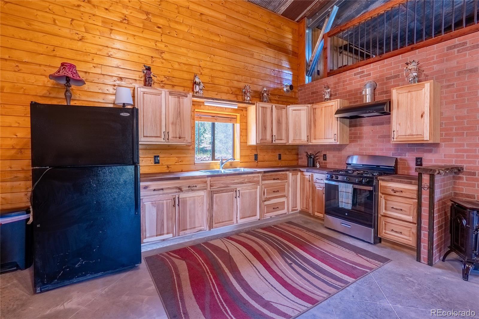 0 Picketwire Road Trinidad, CO 81082 - Photo 12 of 39 a kitchen with stainless steel appliances granite countertop a stove a sink and a refrigerator