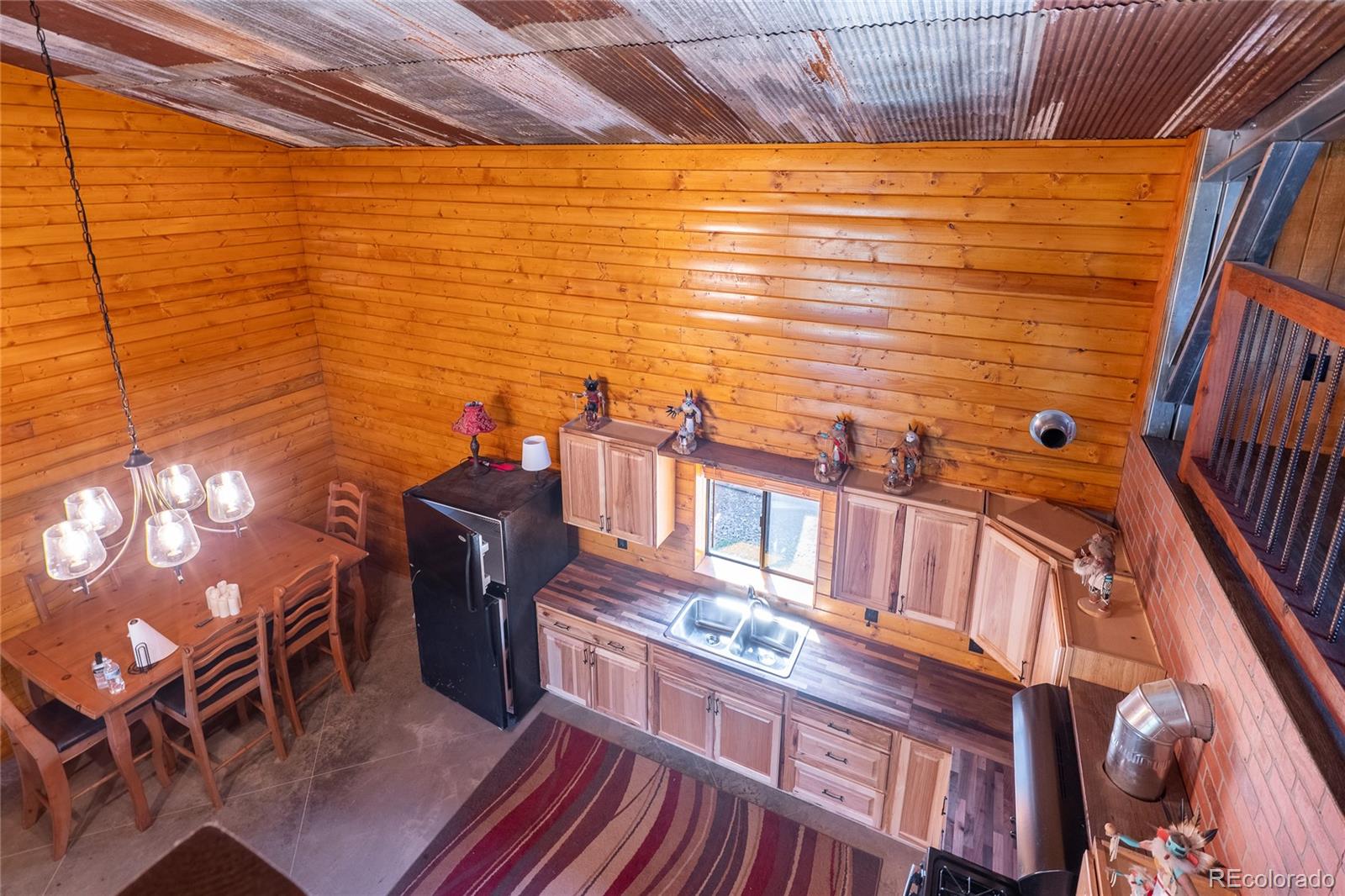 0 Picketwire Road Trinidad, CO 81082 - Photo 13 of 39 a view of a balcony with chair and wooden floor