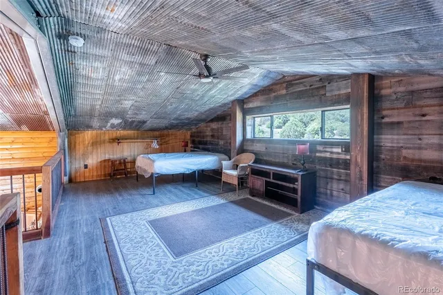 a bathroom with a sink a toilet a mirror and shower