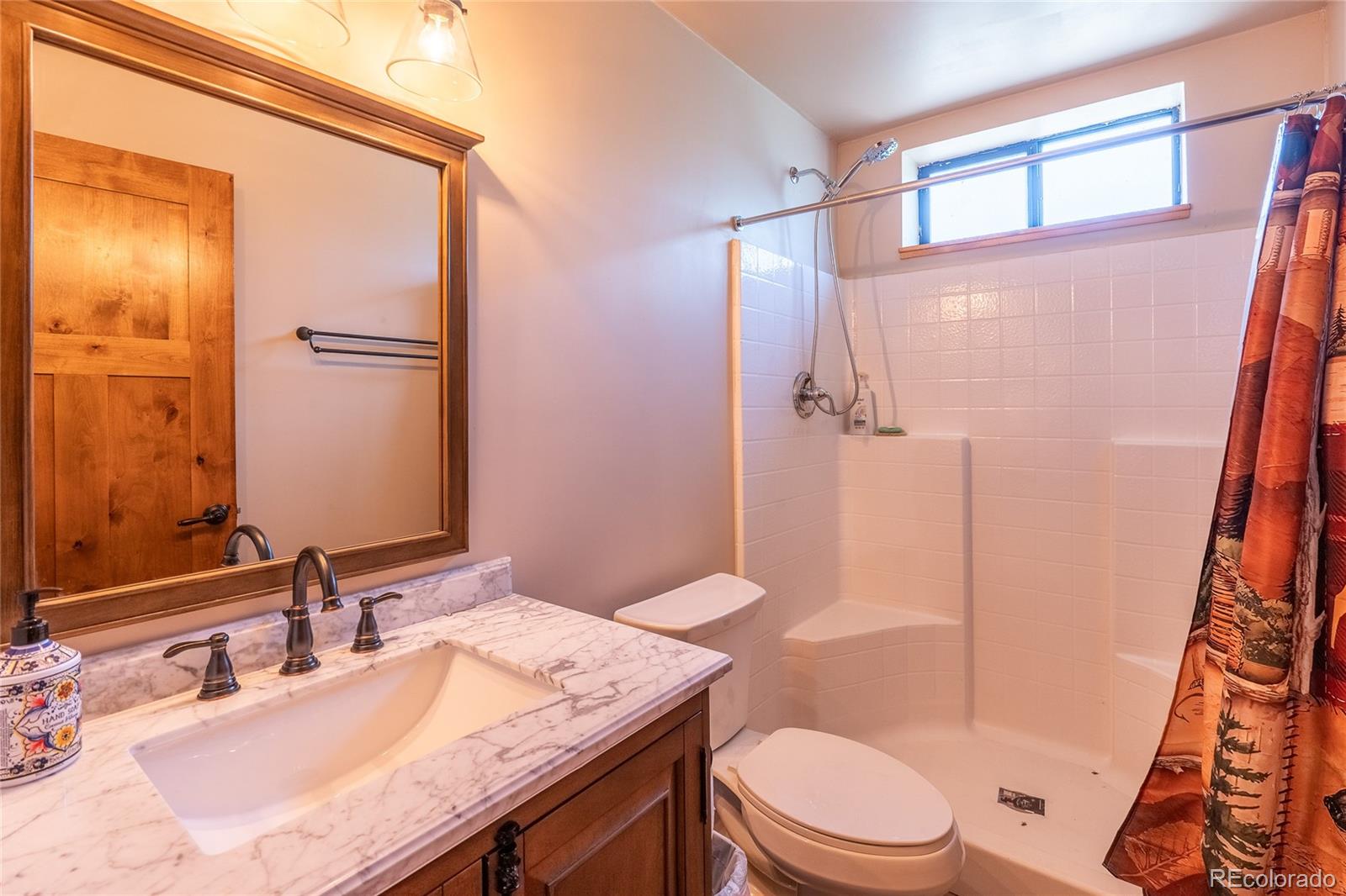 0 Picketwire Road Trinidad, CO 81082 - Photo 22 of 39 a bathroom with a sink a toilet a mirror and shower