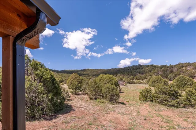a view of a yard from a balcony