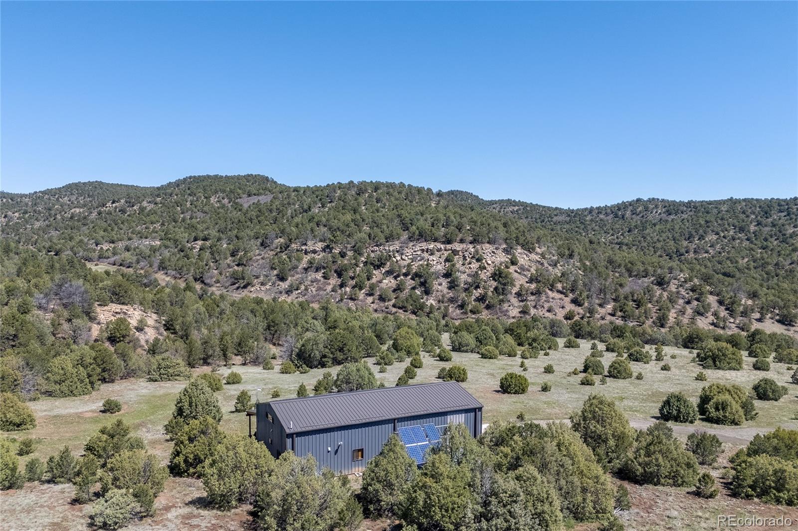 0 Picketwire Road Trinidad, CO 81082 - Photo 33 of 39 an aerial view of a house with a yard