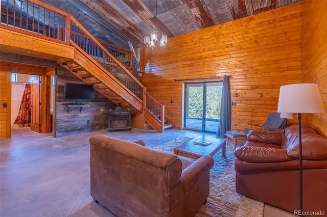 a living room with furniture and a rug