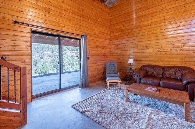 a view of a livingroom with furniture and furniture
