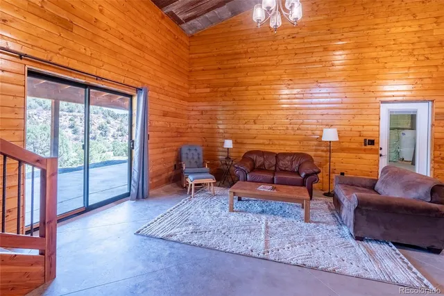 a view of an entryway with wooden floor and a fireplace