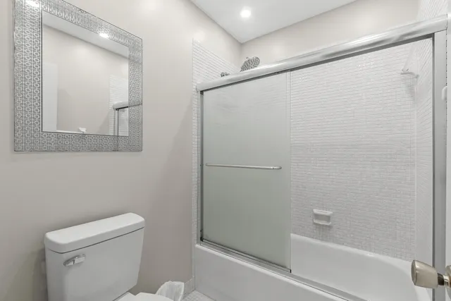 a bathroom with a shower and a toilet