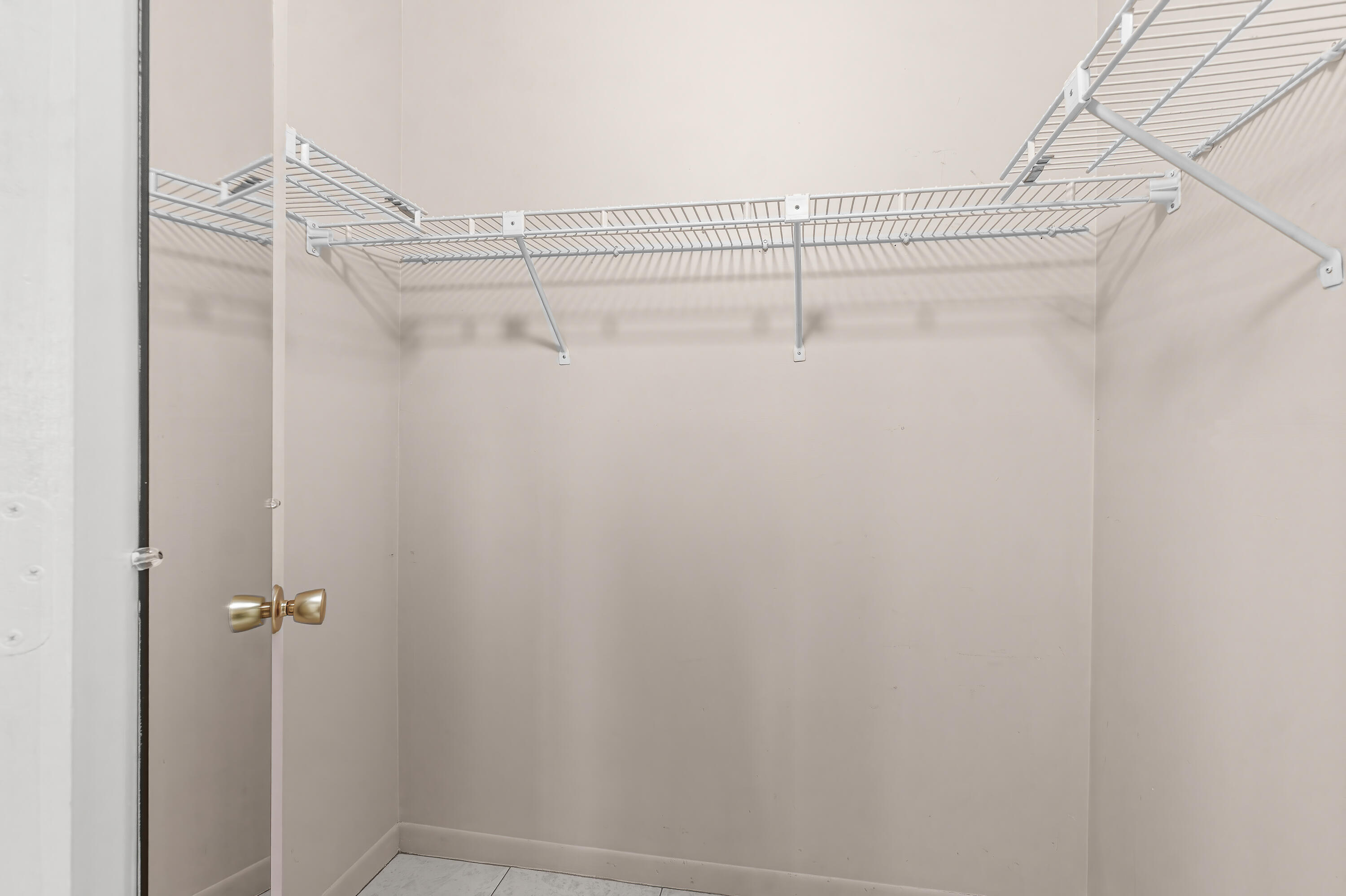 1521 Northwest 19th Terrace, Unit 202 Delray Beach, FL 33445 - Photo 23 of 32 a view of a room with racks on the wall