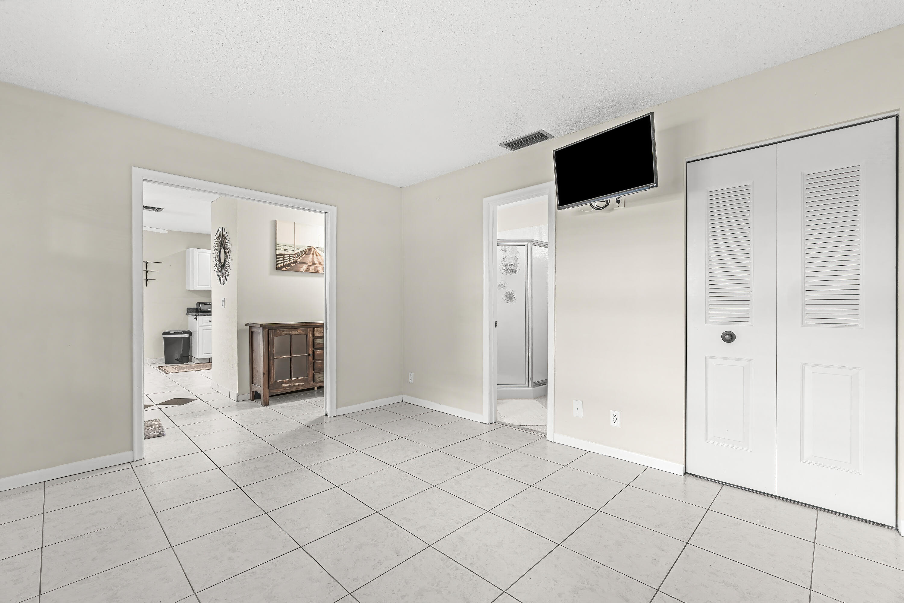 1521 Northwest 19th Terrace, Unit 202 Delray Beach, FL 33445 - Photo 26 of 32 a view of a livingroom with an empty space and a window