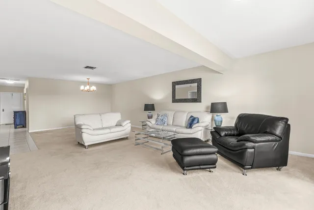 a living room with furniture and a couch