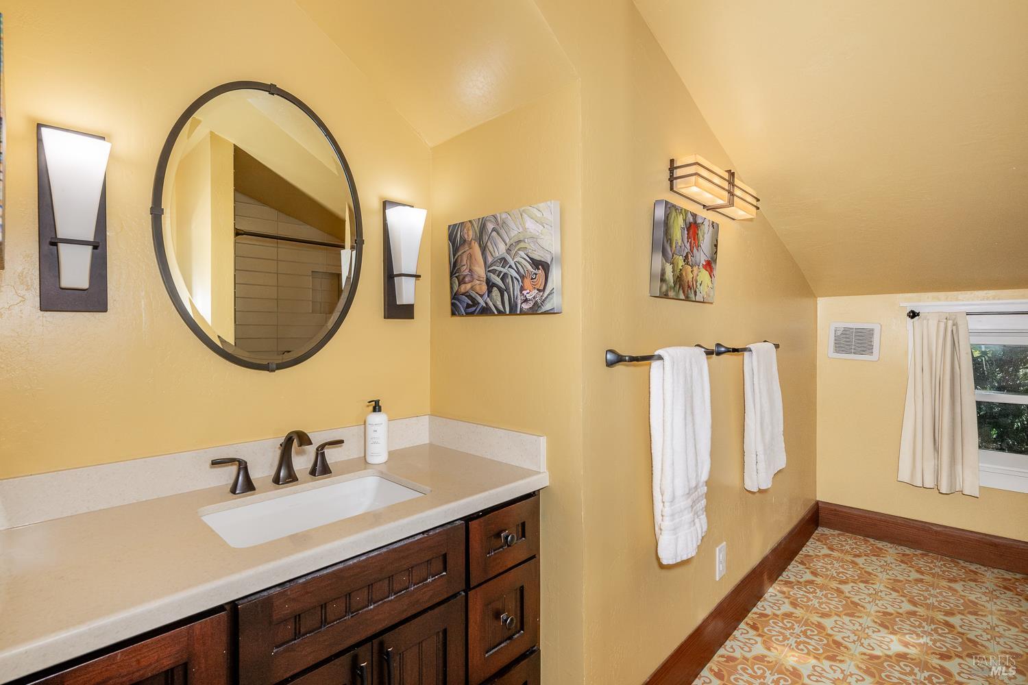 721 Spring Street Santa Rosa, CA 95404 - Photo 20 of 32 a bathroom with a sink and a mirror