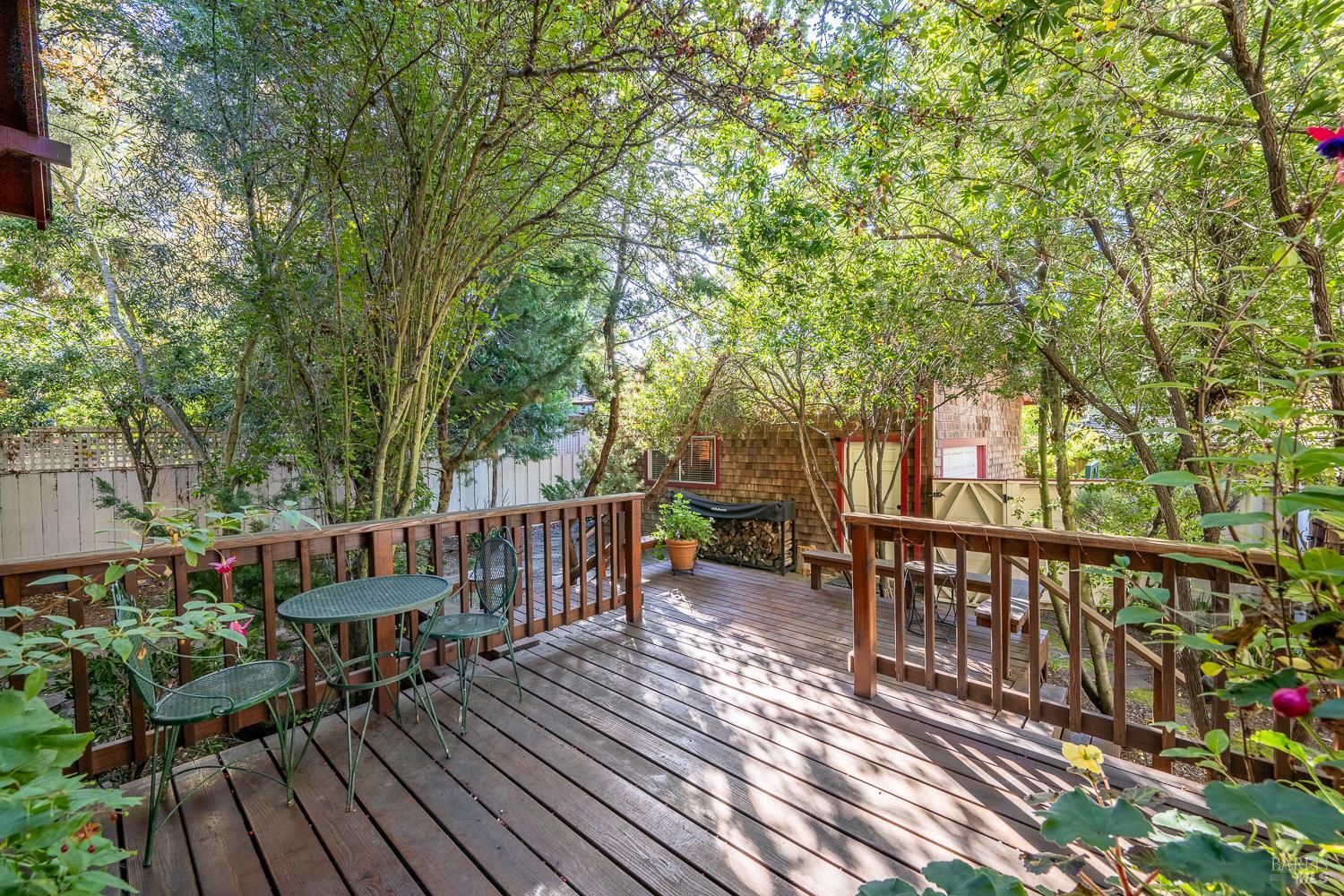 721 Spring Street Santa Rosa, CA 95404 - Photo 24 of 32 a view of a wooden deck with table and chairs and wooden floor