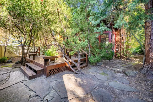 a view of a backyard with sitting area